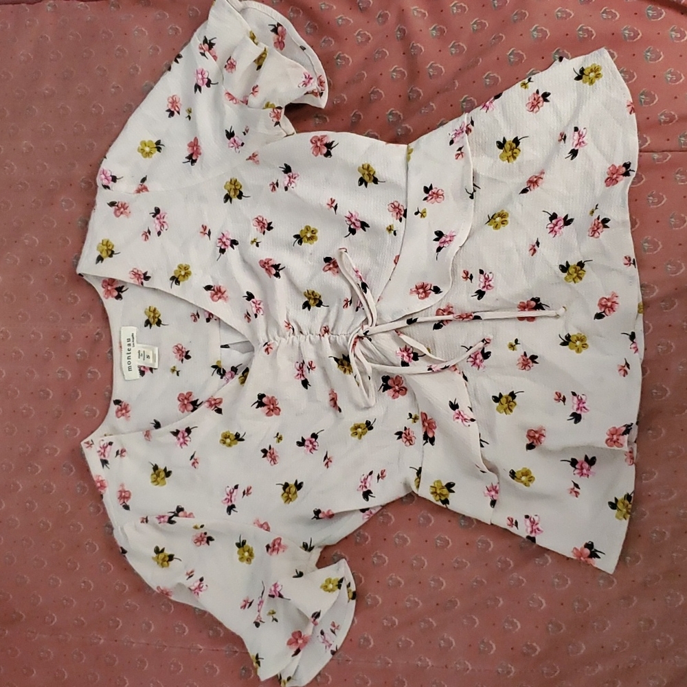 A cream top with flowers